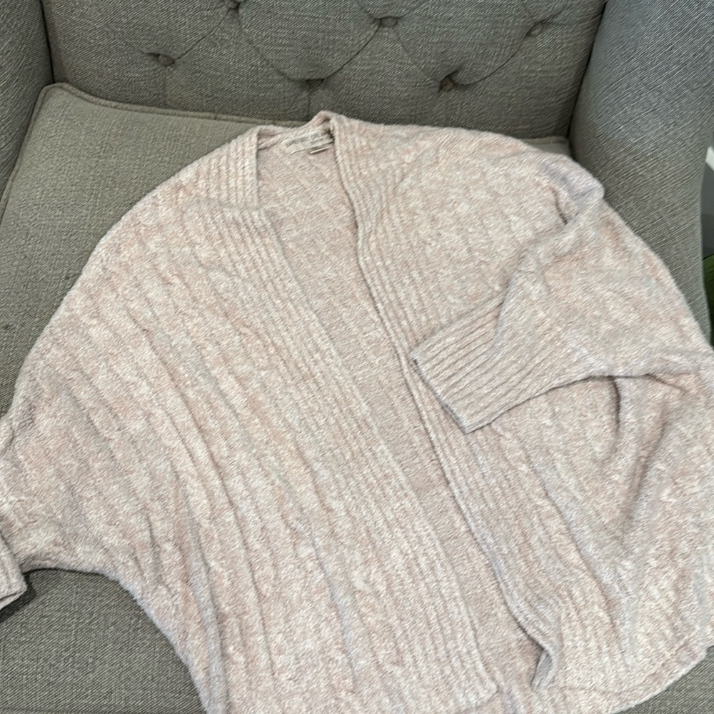 Soft barefoot dreams sweater in pale pink.